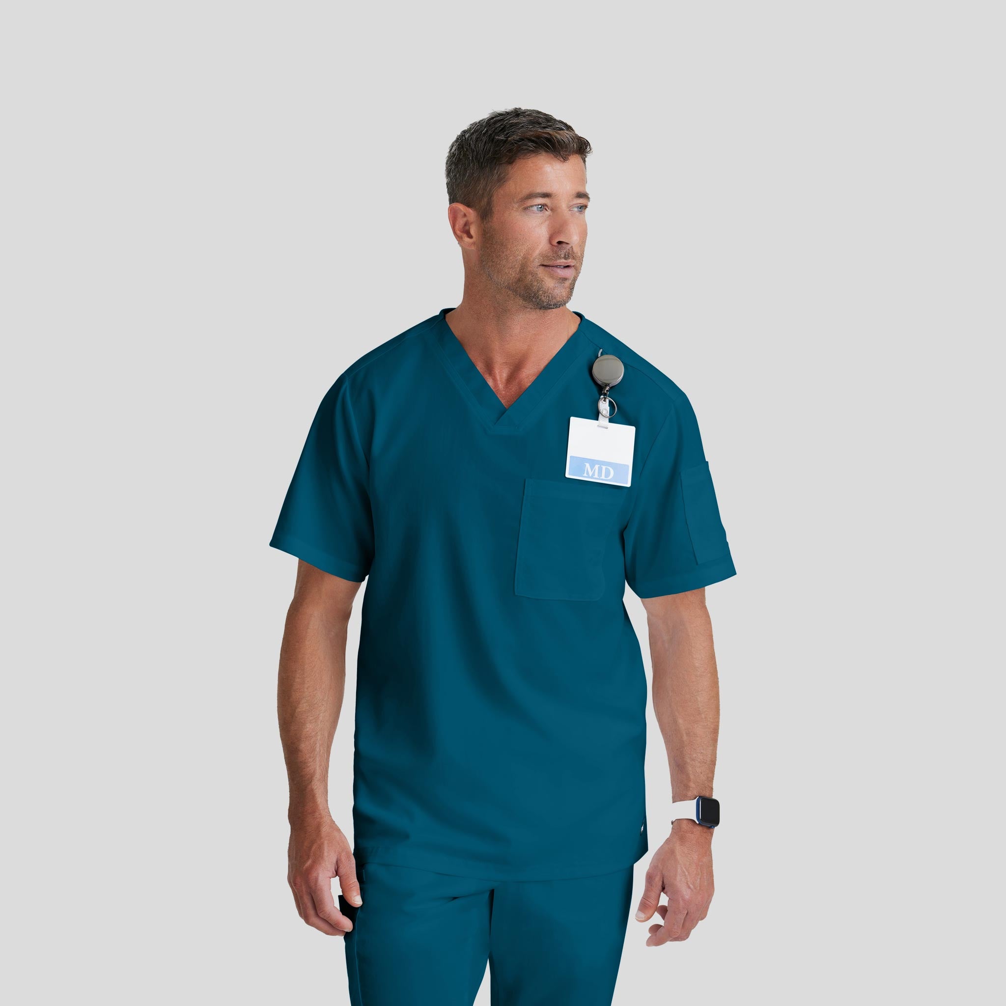 Medical Scrub Top Grey's Anatomy for Men in caribbean blue bahama color at Scrubser Medical Uniforms in Riyad and Jeddan