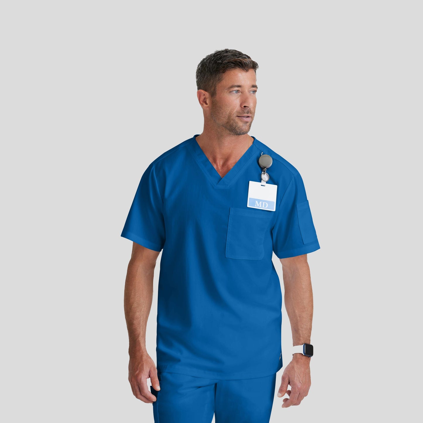 Medical Scrub Top Grey's Anatomy for Men in Royal Blue color at Scrubser Medical Uniforms in Riyad and Jedda
