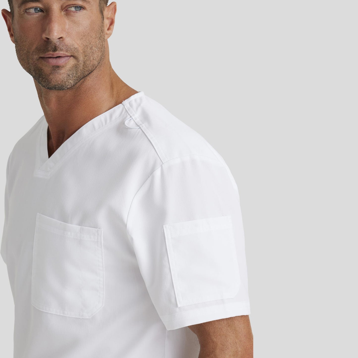 Medical Scrub Top Grey's Anatomy for Men in White color at Scrubser Medical Uniforms in Riyad and Jeddan