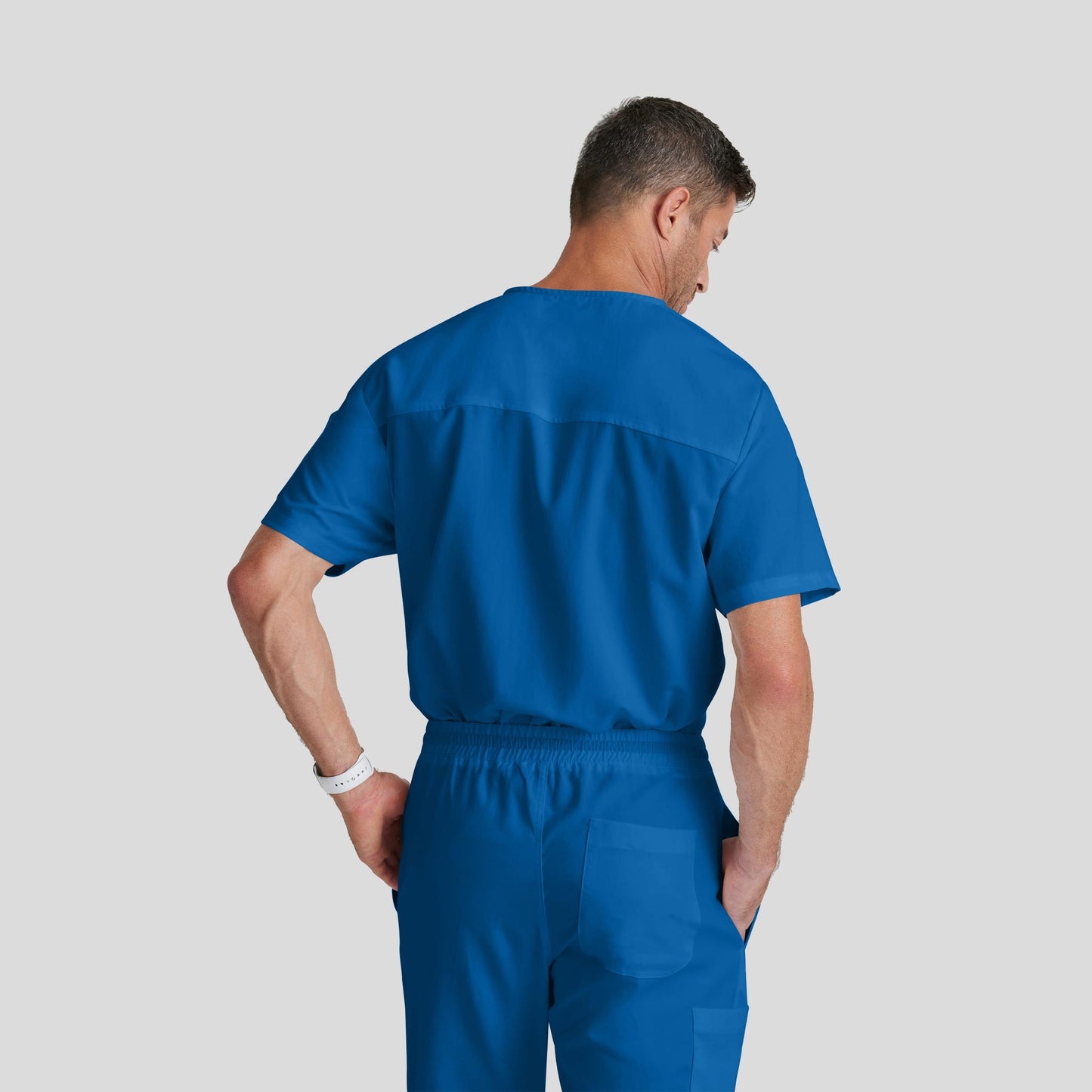 Medical Scrub Top Grey's Anatomy for Men in Royal Blue color at Scrubser Medical Uniforms in Riyad and Jedda