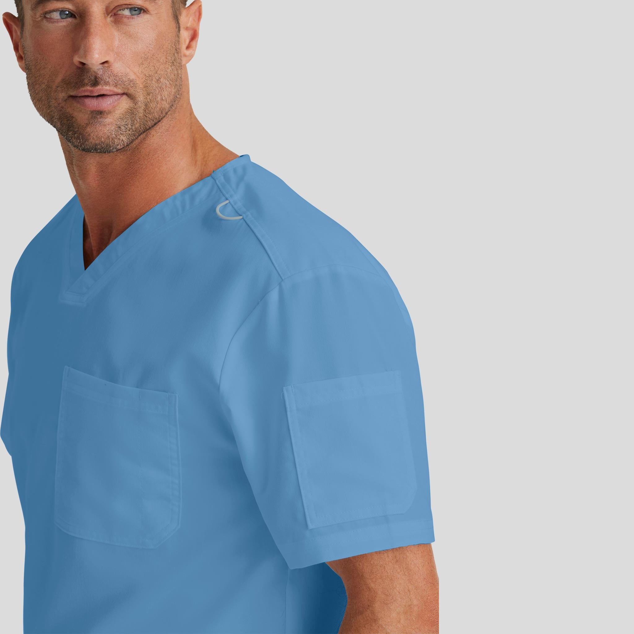 Medical Scrub Top Grey's Anatomy for Men in Ceil Blue color at Scrubser Medical Uniforms in Riyad and Jedda