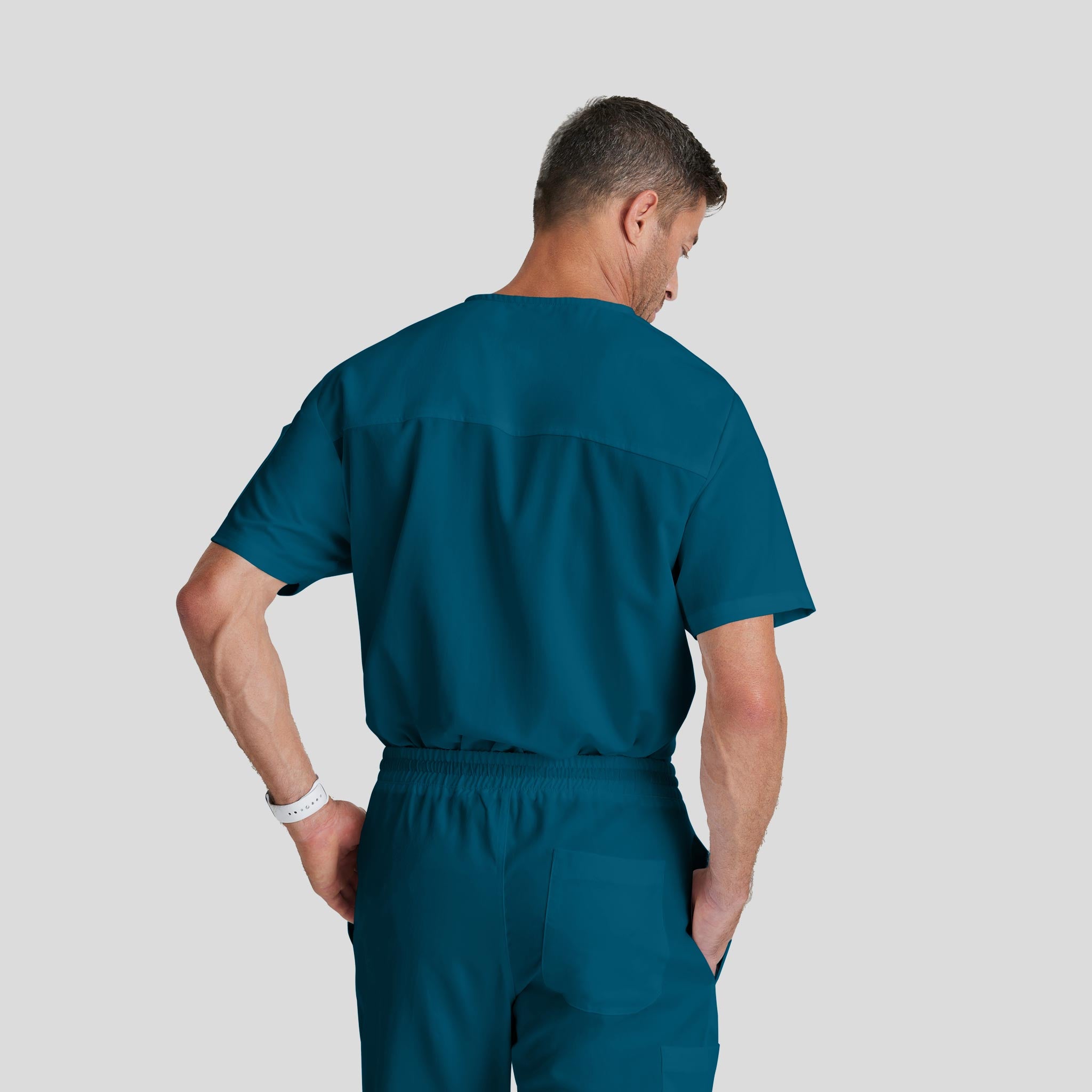 Medical Scrub Top Grey's Anatomy for Men in caribbean blue bahama color at Scrubser Medical Uniforms in Riyad and Jeddan