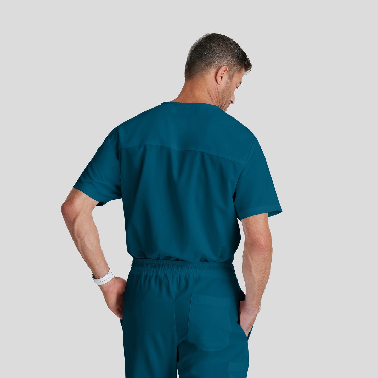 Medical Scrub Top Grey's Anatomy for Men in caribbean blue bahama color at Scrubser Medical Uniforms in Riyad and Jeddan